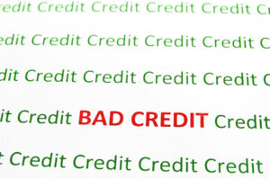 Los Angeles used car dealership - Closeup of Bad Credit text in red Credit in green