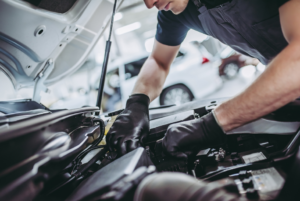 mechanic repairing car engine